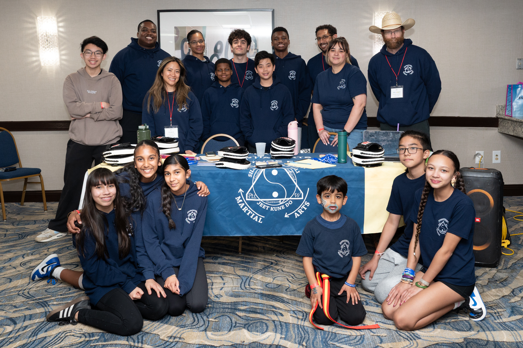 A martial arts company with many participants poses